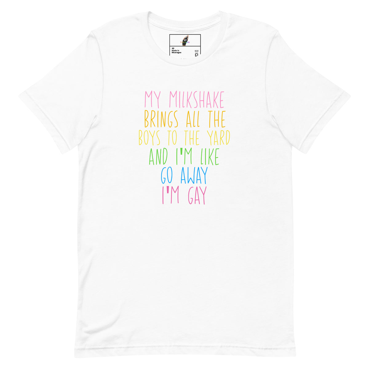 A white short-sleeve crewneck t-shirt featuring a colorful text graphic on the chest that reads 'MY MILKSHAKE BRINGS ALL THE BOYS TO THE YARD AND I'M LIKE GO AWAY I'M GAY' in pastel pink, yellow, green, and blue lettering.