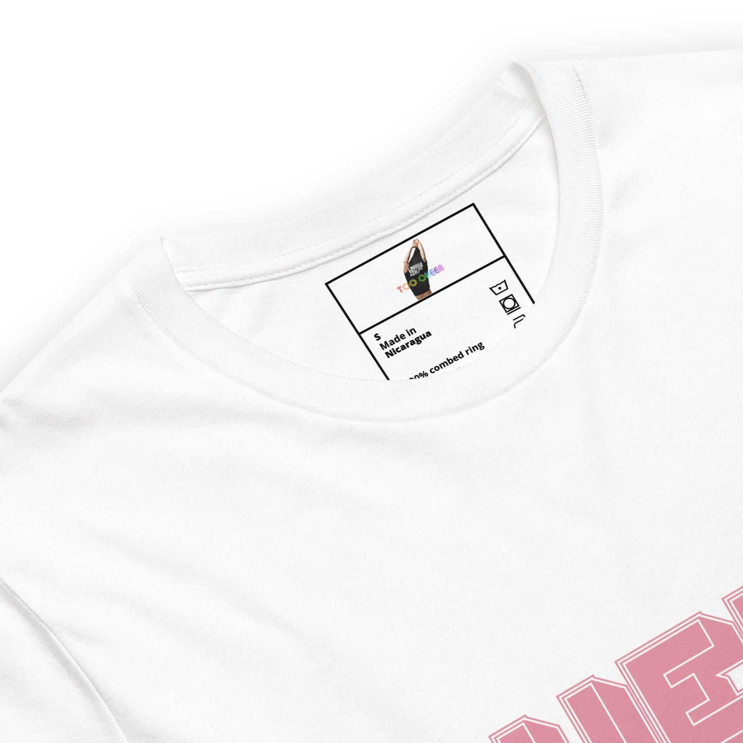 Close-up of a white crewneck t-shirt showing the inner neck label with a graphic of a hand in a black and white boxing pose, and a partial pink graphic on the chest.