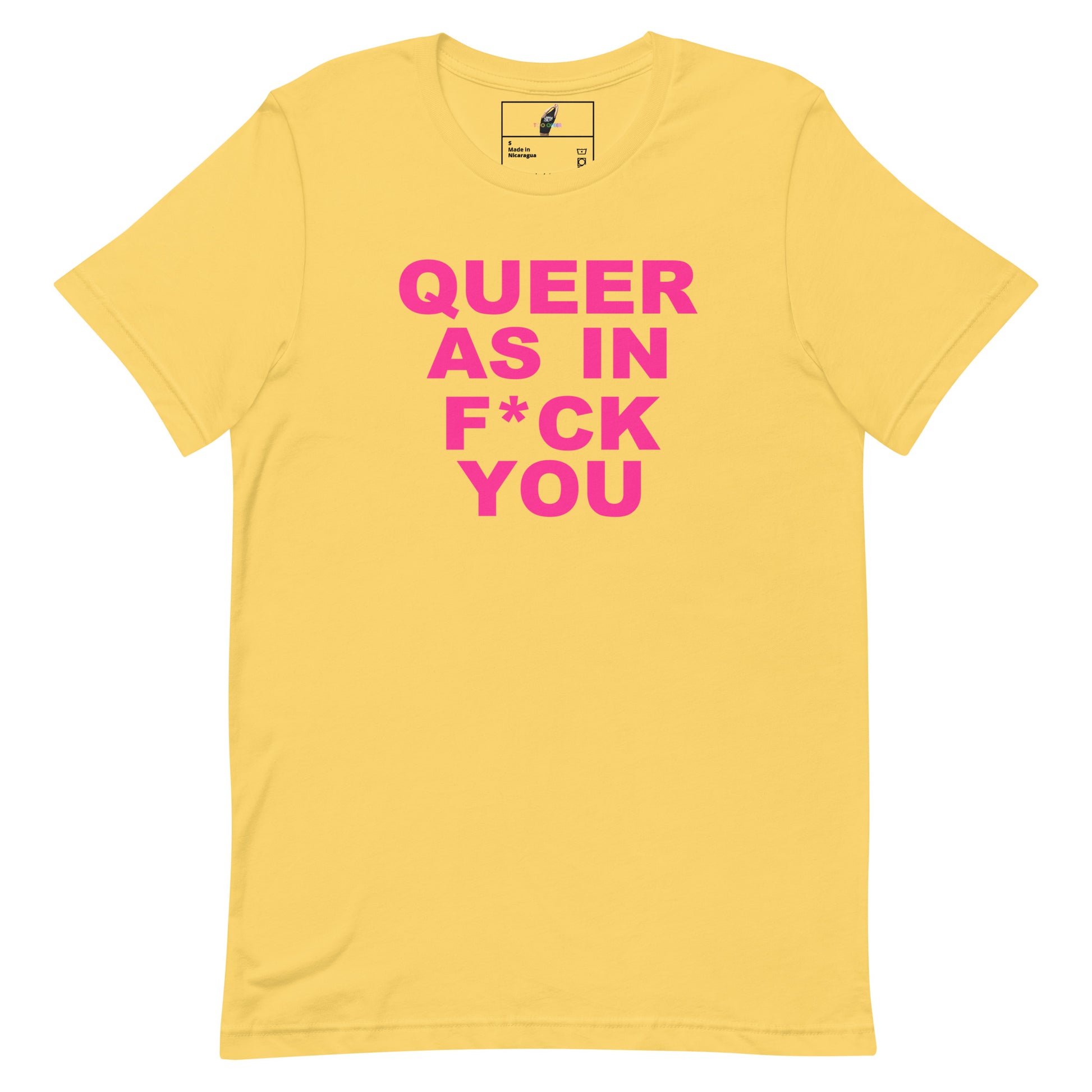 A yellow short-sleeve crewneck t-shirt with bold pink text on the front reading 'QUEER AS IN F*CK YOU'. The shirt is displayed flat against a solid white background, with a small brand label visible inside the collar.