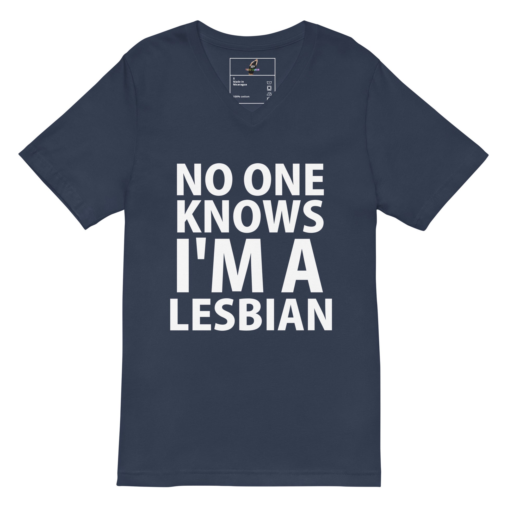 A navy blue short-sleeve V-neck t-shirt with bold white text on the front reading 'NO ONE KNOWS I'M A LESBIAN'. The shirt is displayed flat against a solid white background, with a small brand label visible inside the collar.