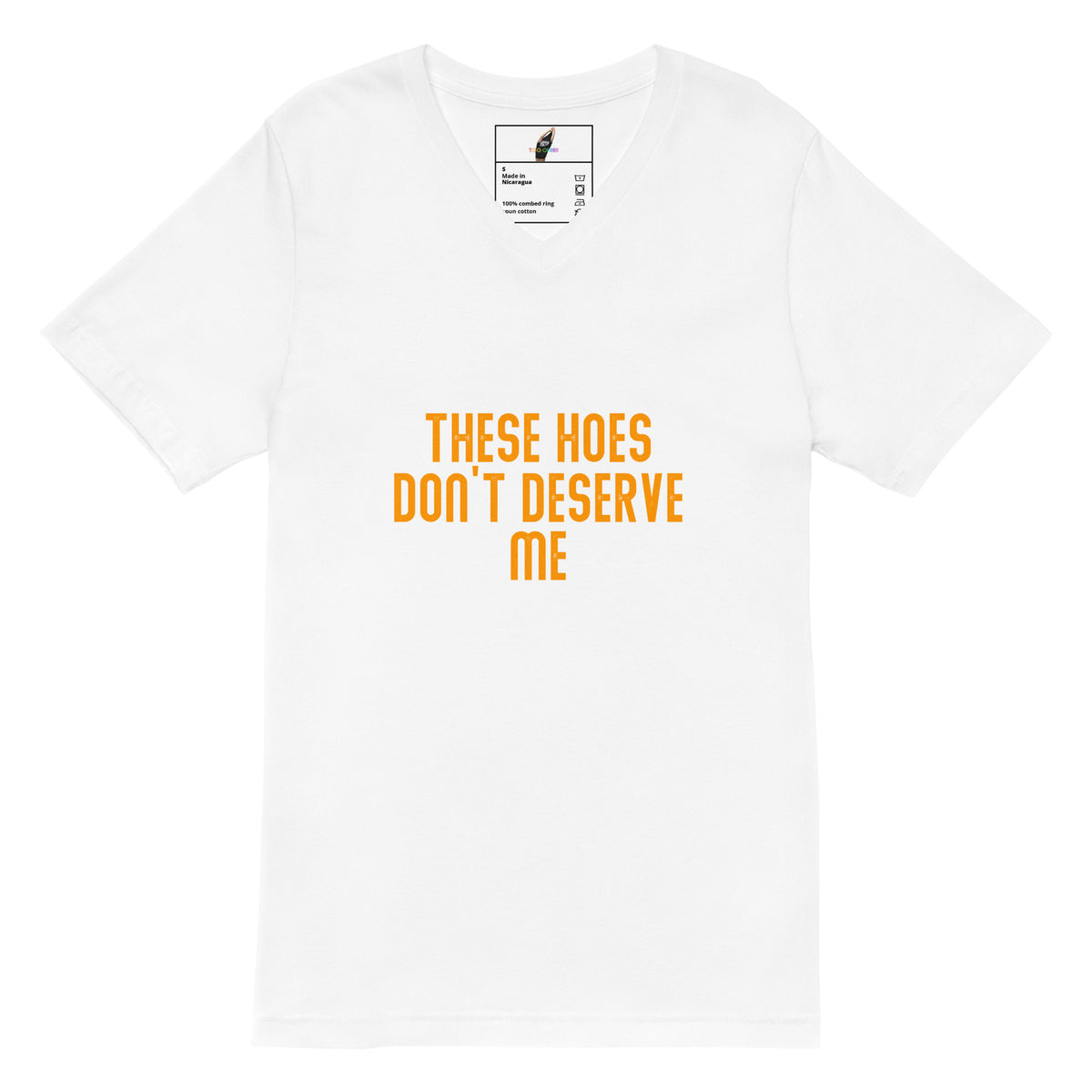 A white short-sleeve crewneck t-shirt with the text 'THESE HOES DON'T DESERVE ME' printed in orange across the chest. The inner neck label features a small graphic of a boot and the brand name 'Griz Shop'.