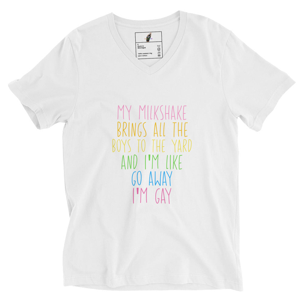A white short-sleeve V-neck t-shirt with a colorful text graphic on the front reading 'MY MILKSHAKE BRINGS ALL THE BOYS TO THE YARD AND I'M LIKE GO AWAY I'M GAY' in pink, yellow, green, and blue lettering.