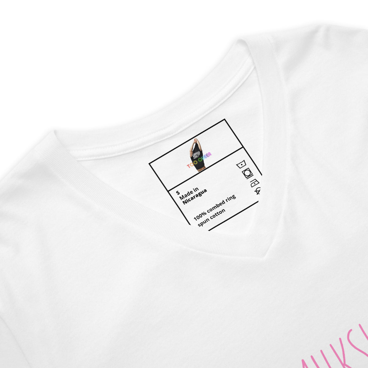 Close-up of a white V-neck t-shirt showing the inner collar print with a small graphic and text, plus a partial pink graphic on the lower right edge.